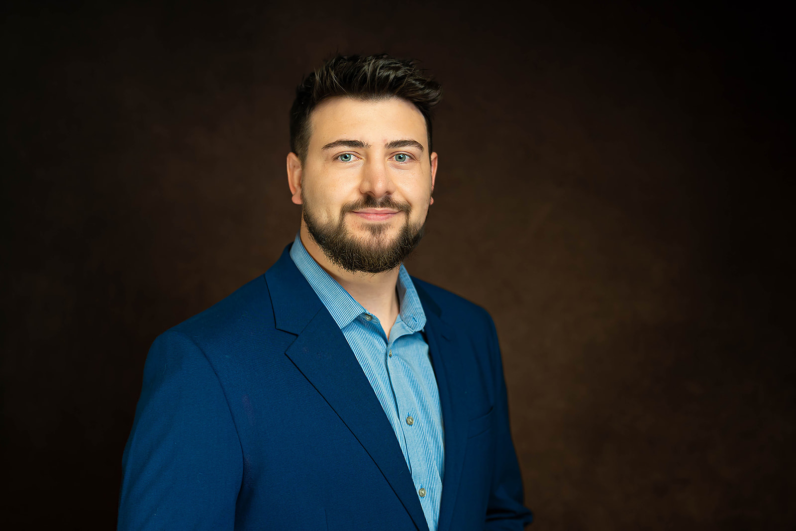 Academic Search executive headshot - navy blazer studio portrait