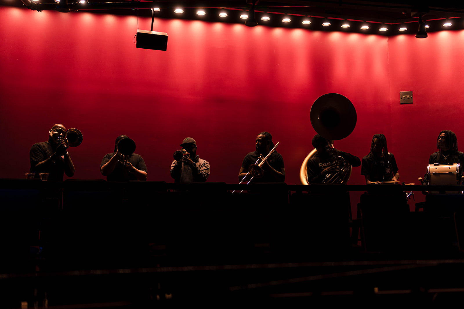 ACLU Bill of Rights brass band - red-lit stage performance