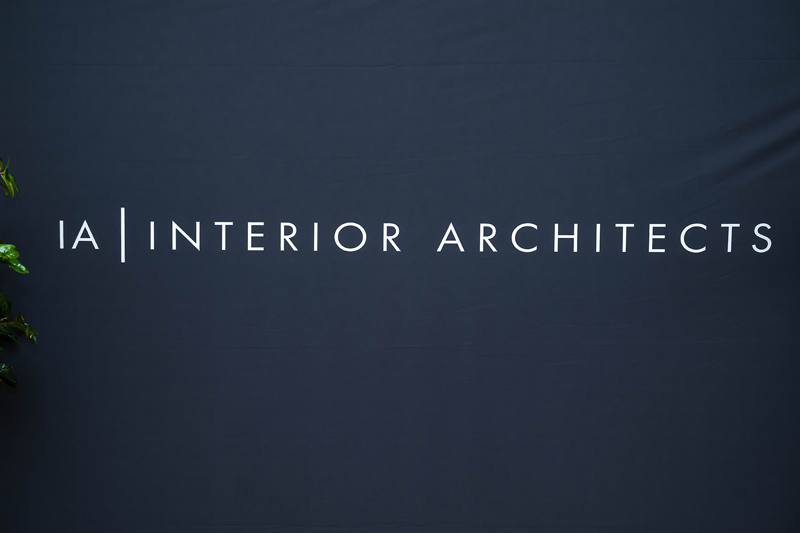 IA Interior Architects branded backdrop - corporate event detail
